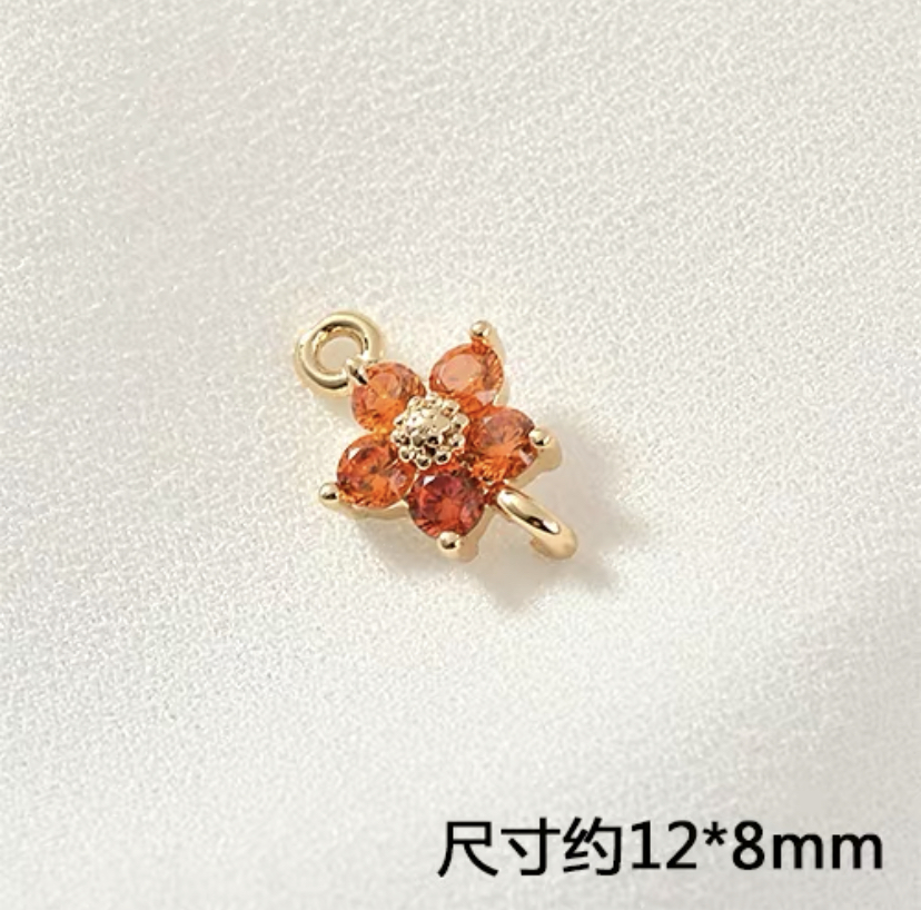 2個入】キラキラ 小さな花パーツ ラインストーン 銅メッキ18k高品質 丸カン二つ オレンジ H005O | iichi  ハンドメイド・クラフト作品・手仕事品の通販