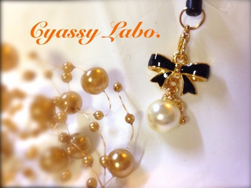 にゃんこパールとリボンのイヤホンジャック☆くろ☆