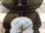 黒猫の振り時計の画像