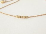 Tiny gold metal necklaceの画像