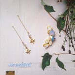 雪降る夜空に輝くオーロラカラーのスター スワロフスキービジューイヤーカフとピアスまたはイヤリングのセット【冬期限定】の画像