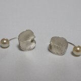 a bud of pierced earring