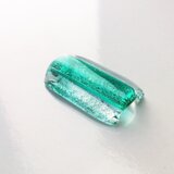 特別なエメラルドグリーンガラス帯留の画像