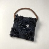 黒の飾り付き　ヘアゴムの画像