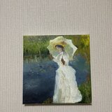 Woman with parasol on morning walkの画像