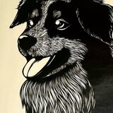 額装済み切り絵作品・笑顔の犬の画像