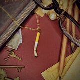 吸い殻のペンダント（金）の画像