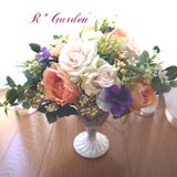 ビタミンカラーのローズラウンドアレンジ