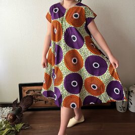 アフリカンバティック柄VネックのAラインワンピース　シンプルな形で柄を楽しむ　波紋柄紫オレンジの画像