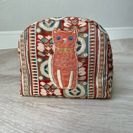 帯のメイクアップ・ポーチ・猫刺繍の画像