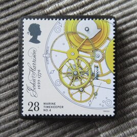 イギリス　機械式時計切手ブローチ10475の画像