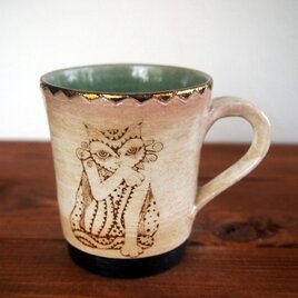 アルケミストのマグカップ（毛繕いをする猫と伸びをする猫）の画像