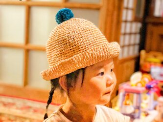 ポンポン付の麦わら帽子《大人サイズ》の画像