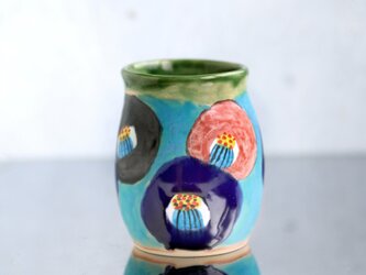 ターコイズブルー釉と椿絵の花器（織部の縁取り）の画像
