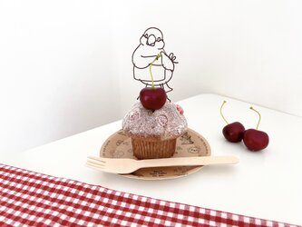 お菓子作りが大好きな文鳥のマフィンオブジェの画像