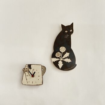 黒猫とジョーロの掛け時計