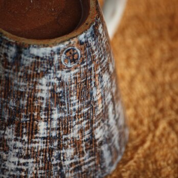 裂織り模様のカップの画像