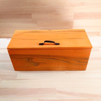 かぼちゃ色のトイレットペーパー収納箱、木製の画像