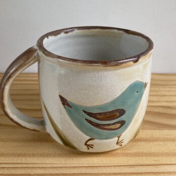 青と緑の鳥のコーヒーカップの画像