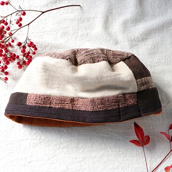 焦げ茶色とクリーム色の綿のマルヒラ帽の画像