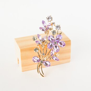 『キラキラな紫色の花ブーケのブローチ』の画像