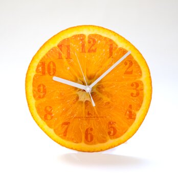 【掛け時計/置き時計】オレンジ（アクリル製）の画像