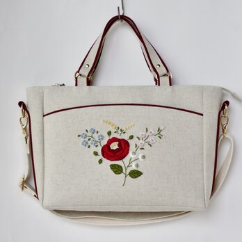 赤い花刺繍のショルダーバッグの画像