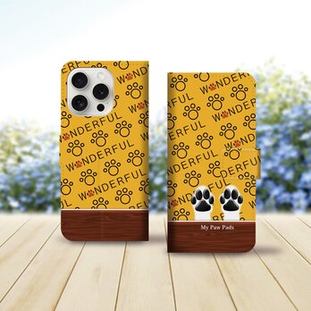 iPhoneスタンダード手帳型スマホケース （カメラ穴あり/はめ込みタイプ）【犬球（Two Paws）マンゴーイエロー】の画像