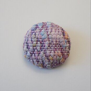 手織りのブローチ