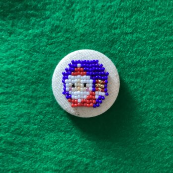 プレゼントを持ったサンタさんのクルミボタン（38mm）の画像