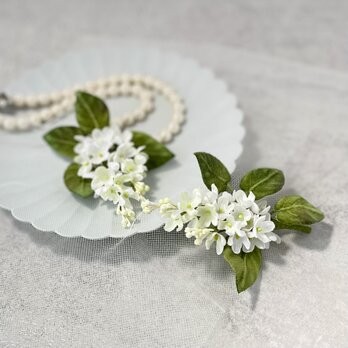 布花　プレゼントに嬉しい、優しい色合いのライラックコサージュの画像
