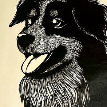 額装済み切り絵作品・笑顔の犬の画像
