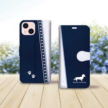 iPhone専用 手帳型スマホケース （カメラ穴あり/はめ込み式/スタンド機能付き）【アイラブ・ミニチュアダックス（ネイビー）】の画像