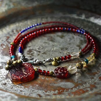 聖者のビーズとたわわな民族鈴、蜜柑＆楕円クリアビーズ、インディゴブルービーズ、つぶつぶブラス、シトリンのネックレス