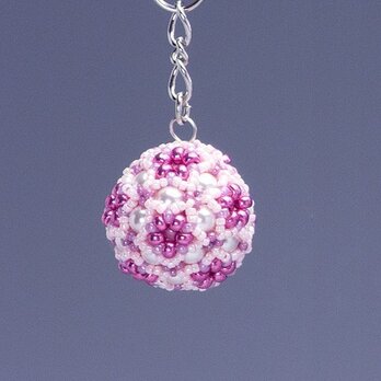星型の花模様のボールの携帯ストラップ・ピンクの画像