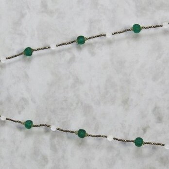 半透明管型筒玉とナガ族パンプキンカット玉のネックレスの画像