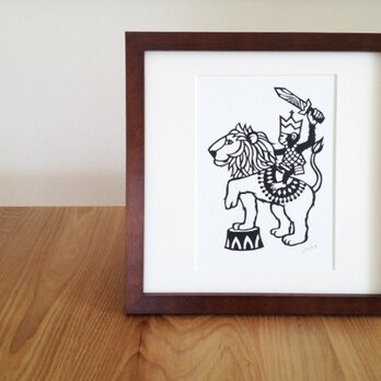 切り絵のサーカス「ライオンと」の画像