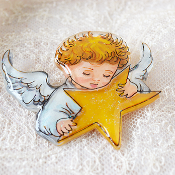 星を抱く天使のブローチ／絵描きの手描きの画像