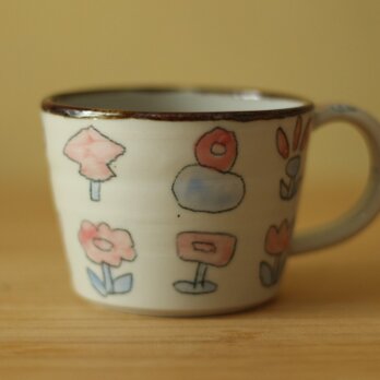お花や木のカップ。の画像