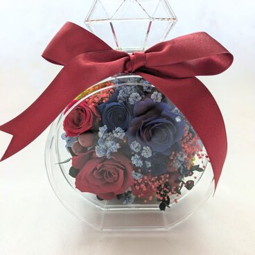 プリザーブドフラワー／青と赤の薔薇が混ざり合う魔法の香水瓶アレンジ／赤リボン