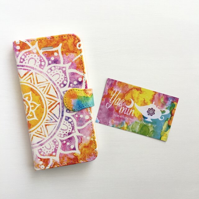 【春・夏】モロッコ風手描き曼荼羅模様　オレンジと紫の手帳型iPhone/Androidケース(留め具orange)の画像1枚目