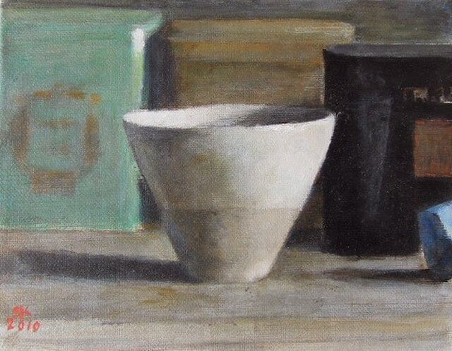 カップと3つの紅茶の缶の画像1枚目