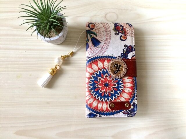 スワロフスキーイニシャル♡タッセルストラップつきiPhone/Experia アンティーク リーフの画像1枚目