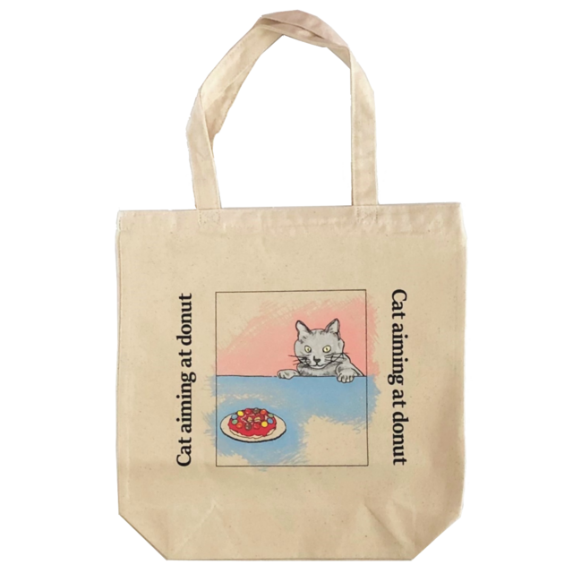 おしゃれなドーナツを狙う猫のキャンパストートバッグ