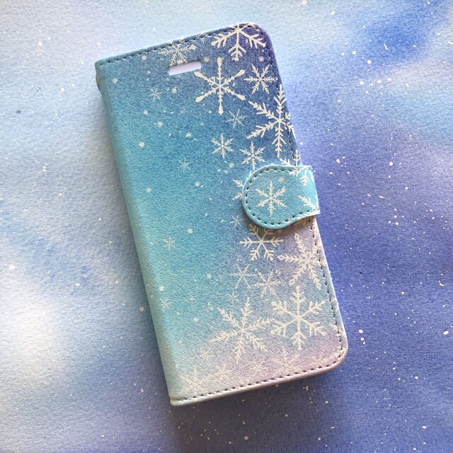 星空に雪の結晶スマホケース 手帳型 【受注生産】アンドロイド iPhoneケースの画像1枚目