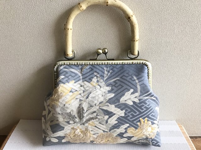 がまぐちバッグ バンブー持ち手・水色に黄色花柄の画像1枚目