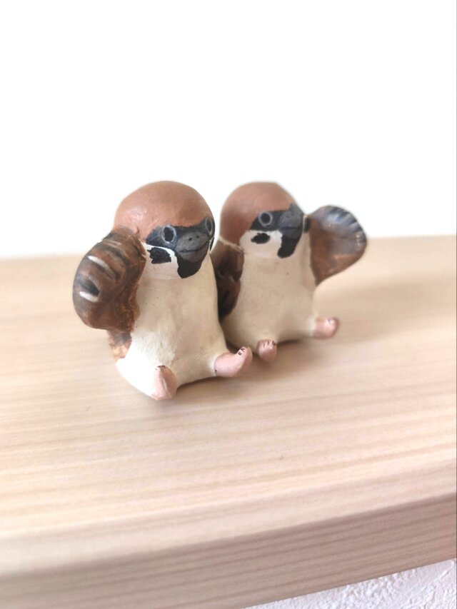 風を掴む招き雀さん