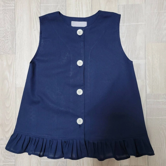 【80～160】ネイビー 無地 シンプル 紺 前ボタン ノースリーブ 袖なしスモック 裾フリル 着丈延長可