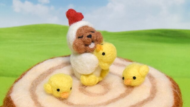 ヒヨコさんのお世話をしているニワトリコグマの画像1枚目