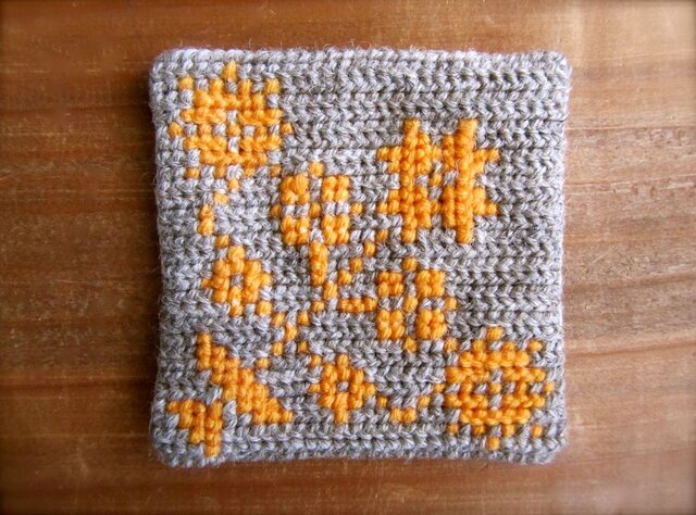 ツヴィスト刺繍のコースター 花 オレンジの画像1枚目